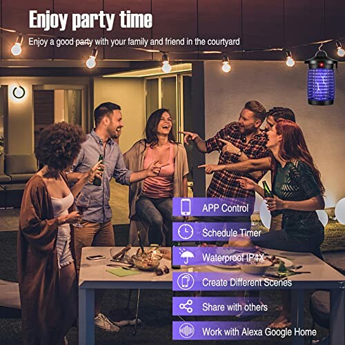 Group of people enjoying a party in a courtyard with string lights and a Bluetooth speaker.